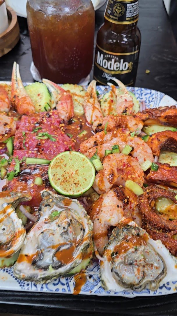 Mexican seafood dishes on simple tableware.