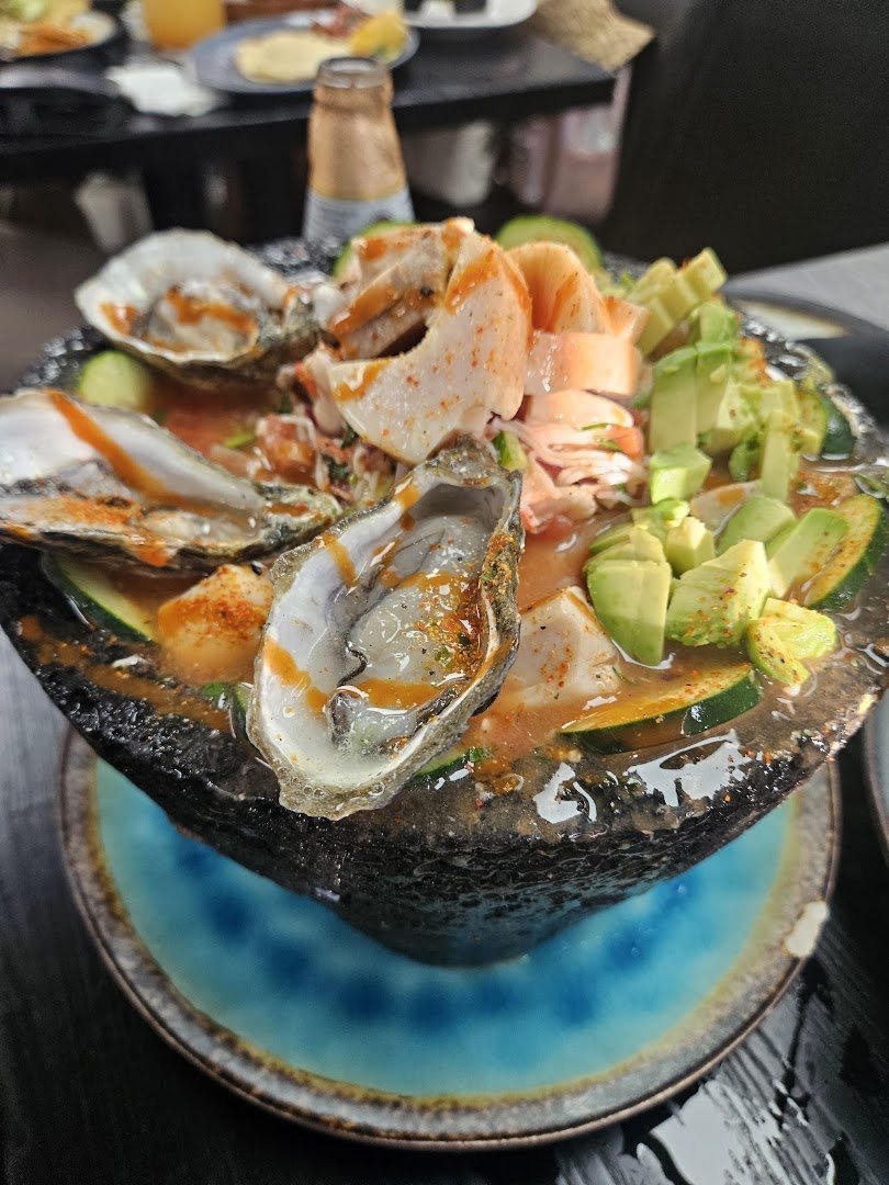 Fresh ceviche-style plates served indoors.