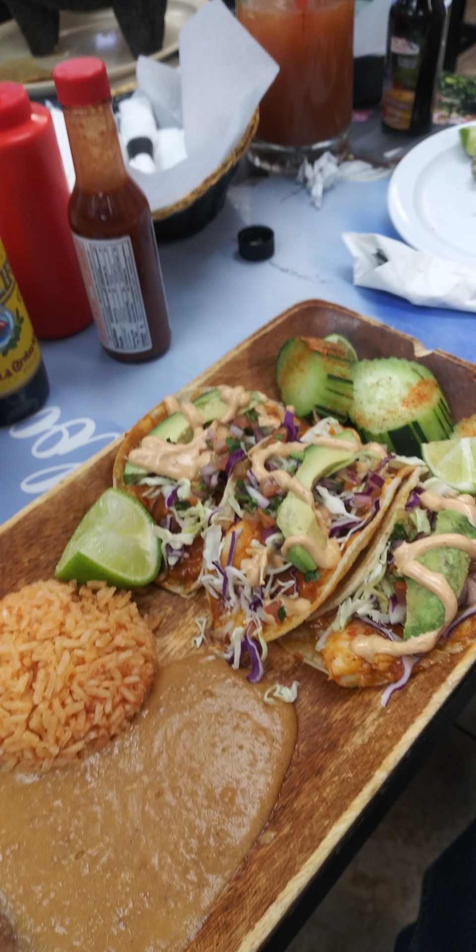 Printed menu with seafood and taco sections.